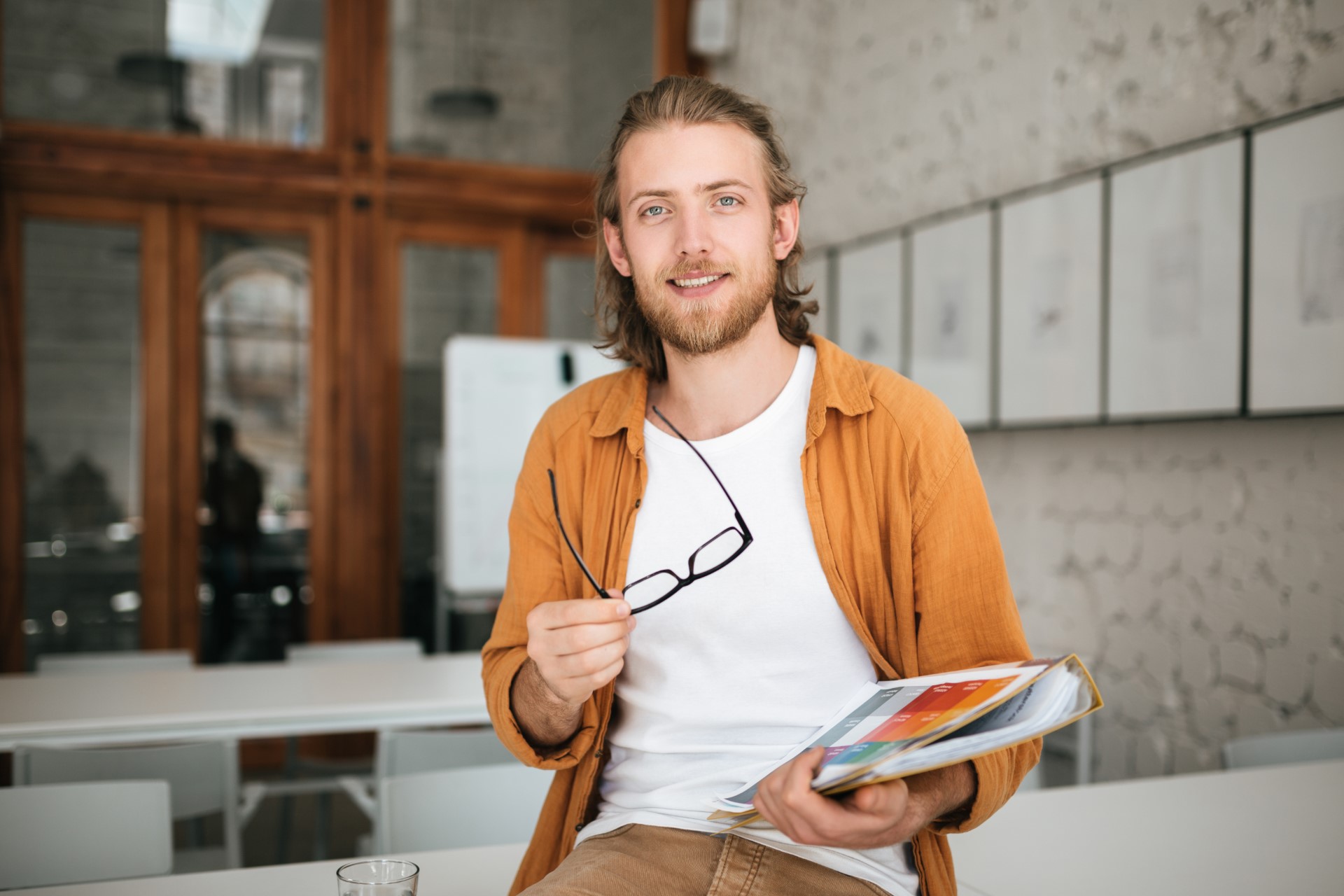 smiling-boy-with-blond-hair-and-beard-joyfully-loo-5USXMTR.jpg